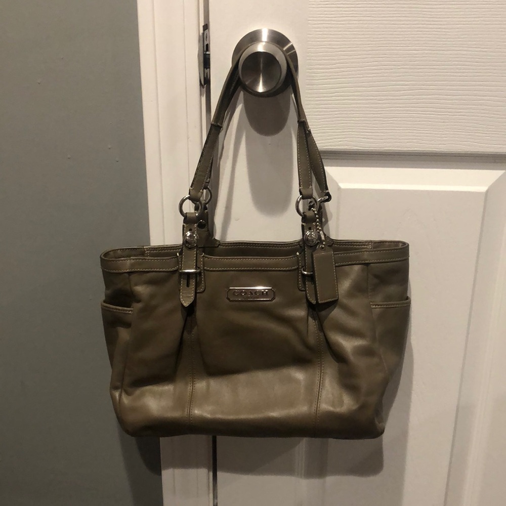 Two handle coach bag in a taupe/beige color. Used.